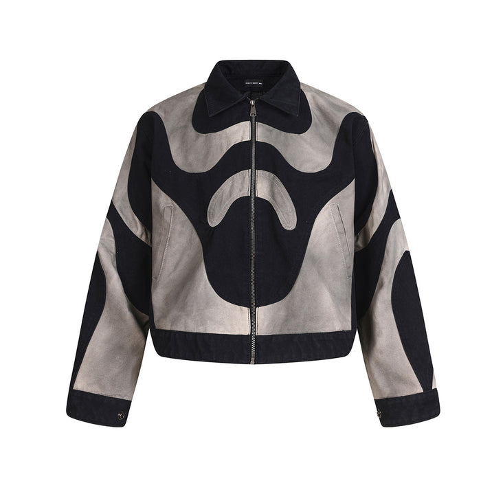 Cropped abstract patchwork zip jacket in black and washed grey two-tone canvas with organic panel design, front view