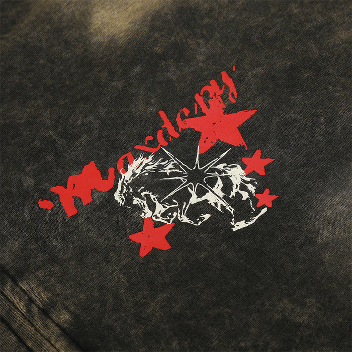 Close-up of a red-and-white rider graphic with stars printed on the dark acid-wash hoodie