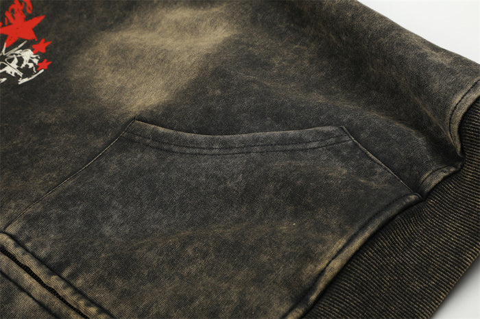 Close-up of the hoodie’s kangaroo pocket, acid-wash fabric, stitching, and ribbed hem