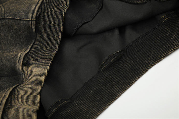 Close-up of the hoodie’s black inner lining and ribbed hem construction