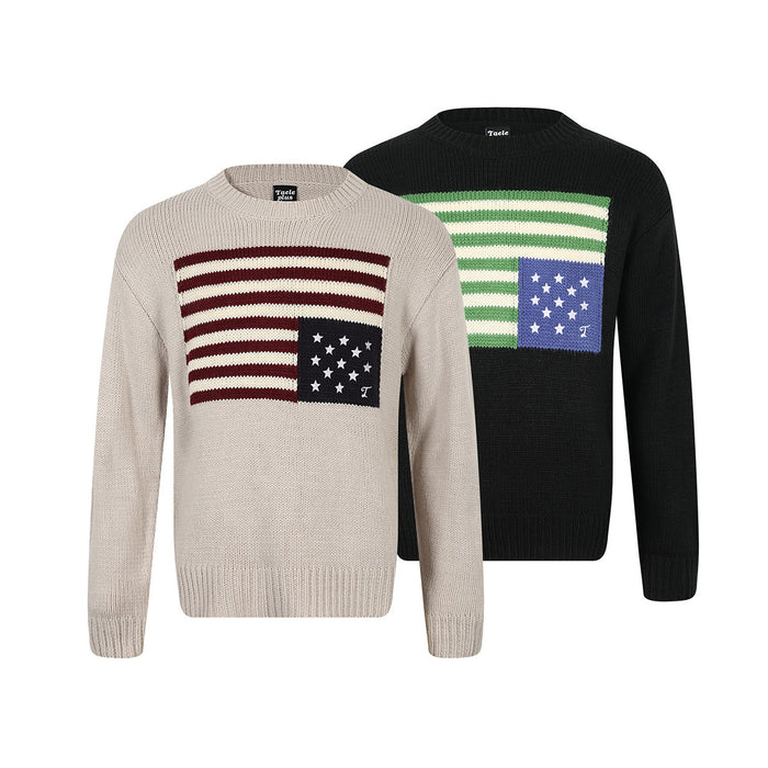 Two intarsia knit crewneck sweaters, beige and black, with contrasting striped panels and star motifs