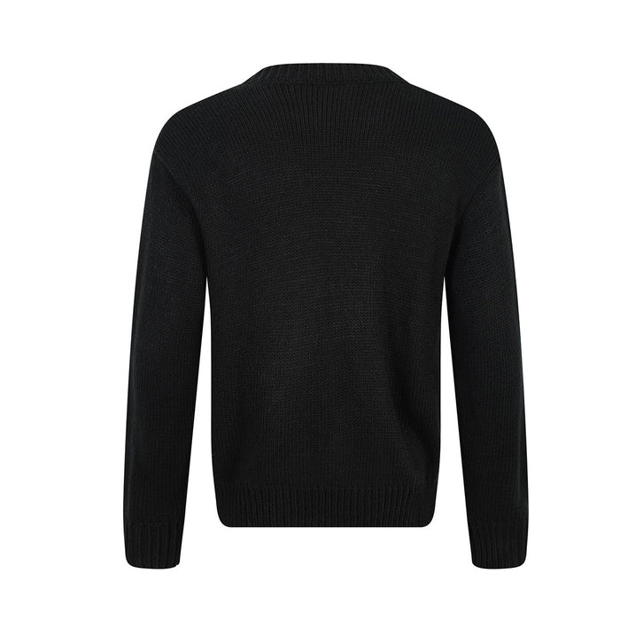 Back view of a black knit crewneck sweater with plain textured fabric and ribbed cuffs