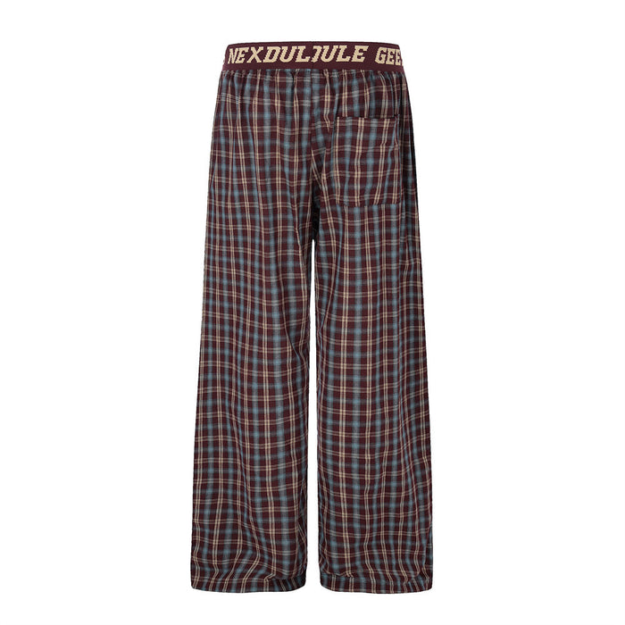 Back view of burgundy plaid wide-leg pants with one back pocket and elastic waistband