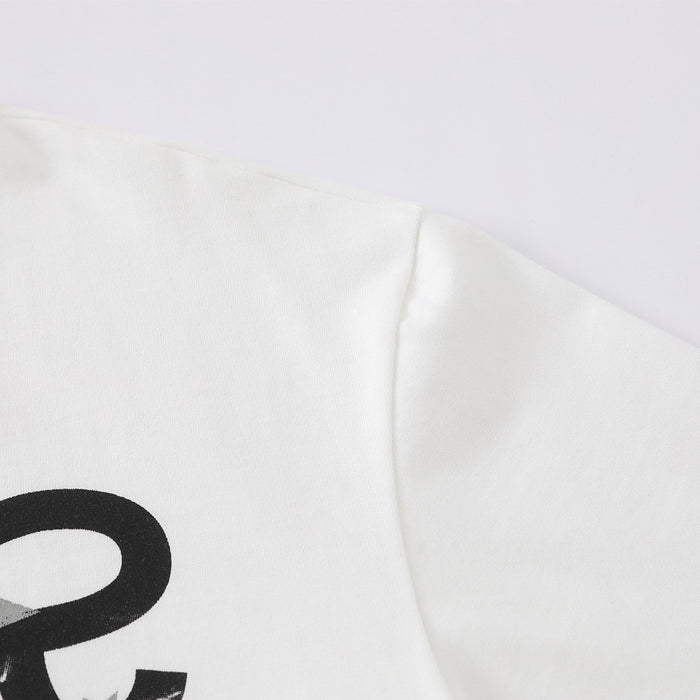 Close-up of white T-shirt sleeve and shoulder seam