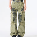 Acid wash army green wide-leg cargo pants with tribal flame graphic and letter print, multiple cargo pockets, worn by female