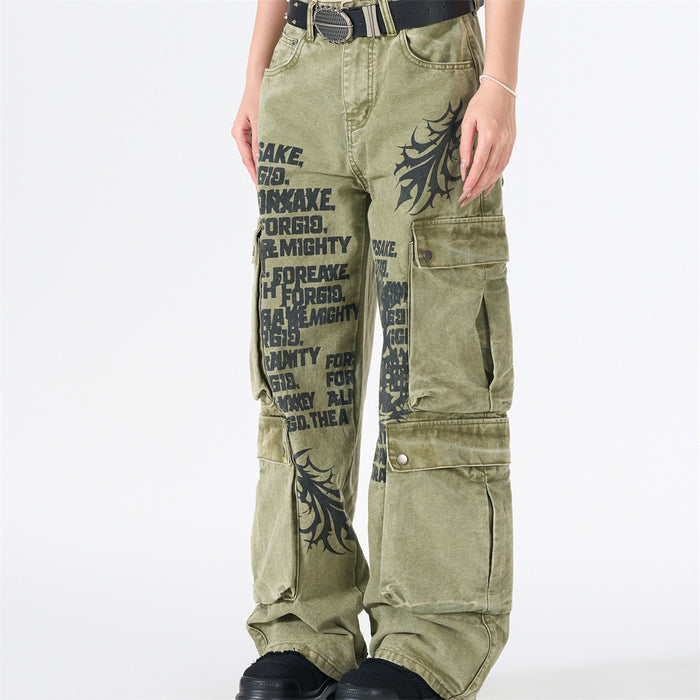 Model wearing army green wide-leg cargo pants with black tribal graphics and side cargo pockets