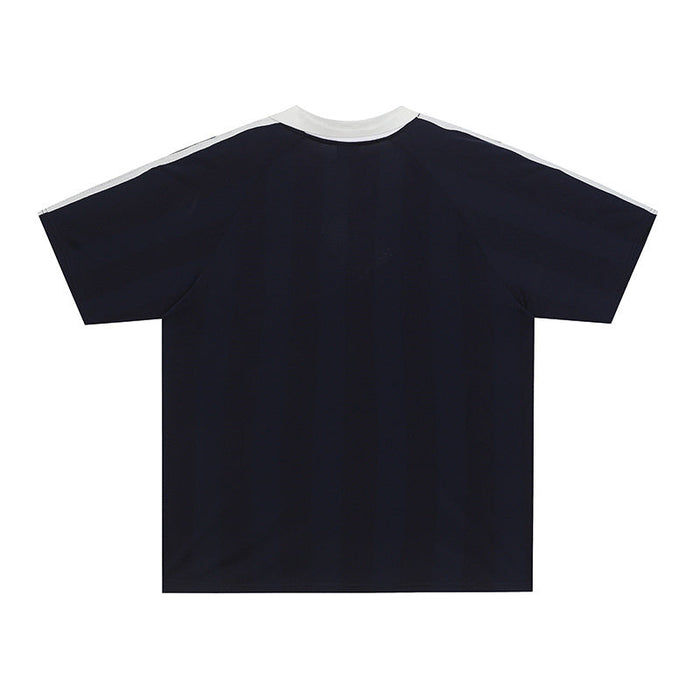 Black Baenbofu performance soccer jersey with white crew neck and shoulder stripes, laid flat on a white background