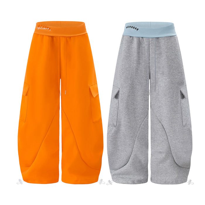 Baggy wide-leg cargo sweatpants in orange and gray with contrast ribbed waistband and curved seam detail