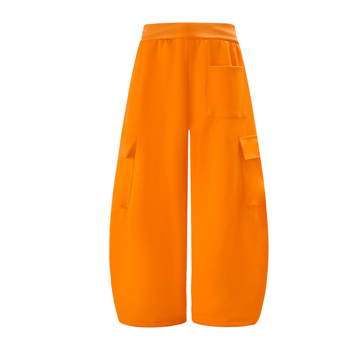 Back view of bright orange wide-leg cargo sweatpants with a rectangular pocket and side cargo pockets