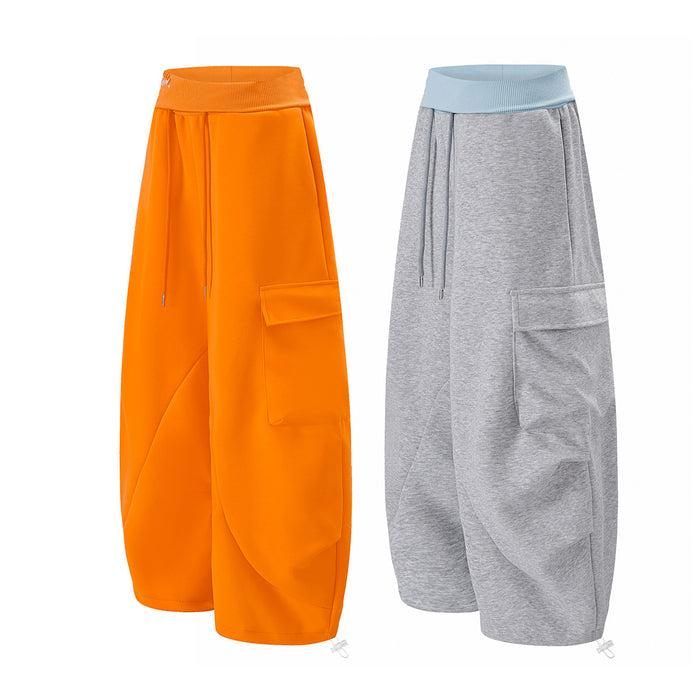 Gray and bright orange wide-leg cargo sweatpants displayed together, showing contrasting color options