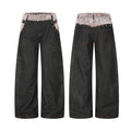 Black wide-leg baggy jeans with fold-over sherpa waistband, pyramid studs, and tonal tribal embroidery, front and back view