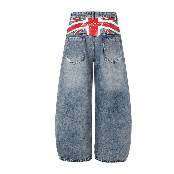 Back view of light blue wide-leg jeans with rear pockets and a red, white and black Union Jack waistband