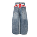 Back view of light blue wide-leg jeans with rear pockets and a red, white and black Union Jack waistband