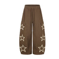 Baggy wide-leg cargo sweatpants with oversized star appliqués in brown, featuring flap cargo pockets and ankle zip closures
