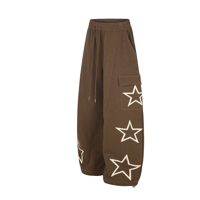 Angled view of brown wide-leg cargo sweatpants showing side pockets and outlined star graphics