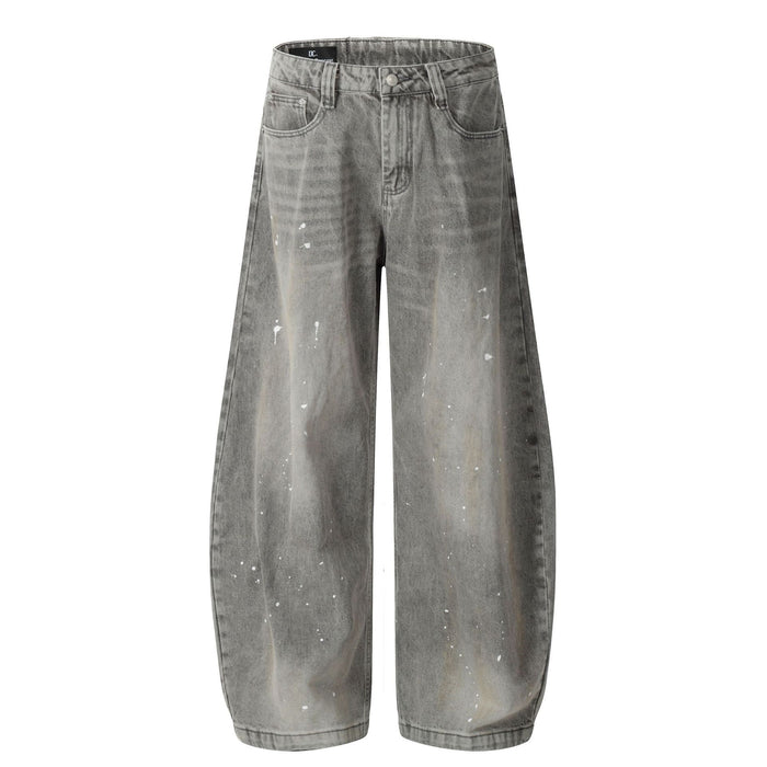 Baggy wide-leg grey acid-washed denim jeans with white paint splatter detailing, front and back view