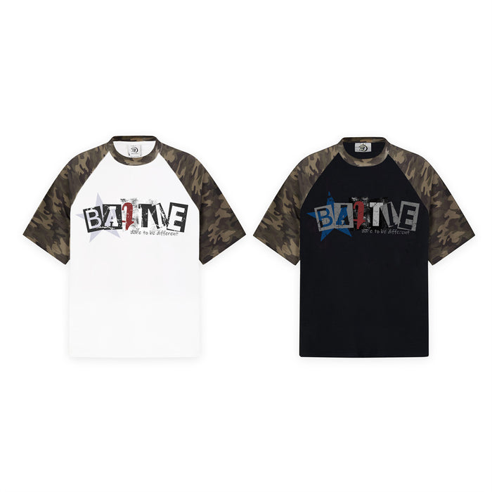 BATTLE graphic raglan sleeve T-shirt with camouflage shoulders, shown in white and black color block styles