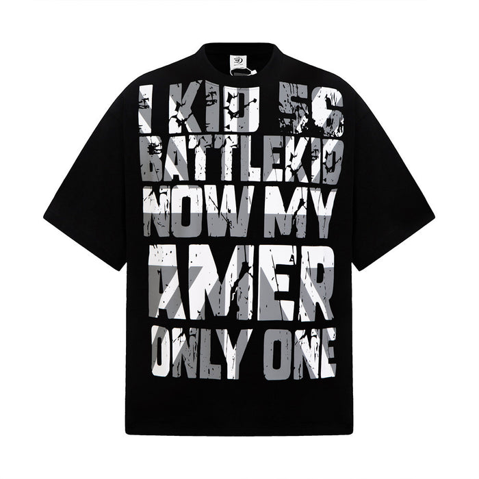 Black oversized graphic T-shirt with bold distressed white text print and relaxed hip hop streetwear style