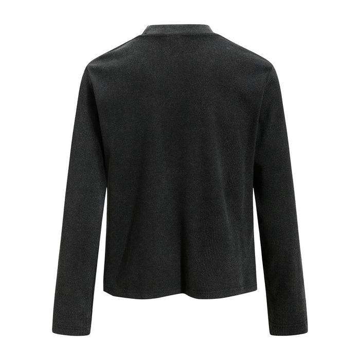 Back view of a plain black waffle knit long sleeve shirt with a ribbed crew neckline