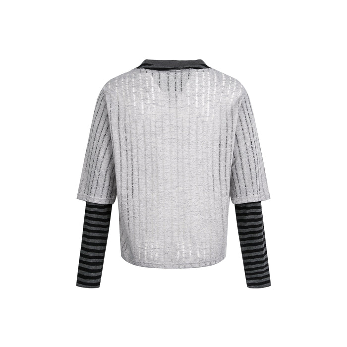 Back view of gray layered sweater top with black striped long sleeves