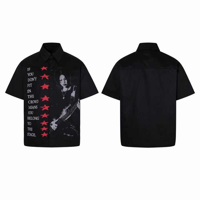 Black short-sleeve button-up shirt with rock guitarist graphic, red stars, and inspirational quote on the front panel