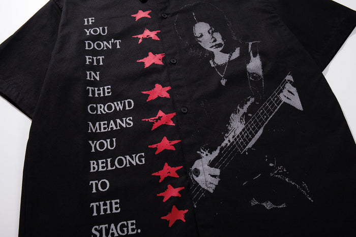 Black button-up shirt with graphic guitarist print and bold punk-style text, featuring red star accents and streetwear styling