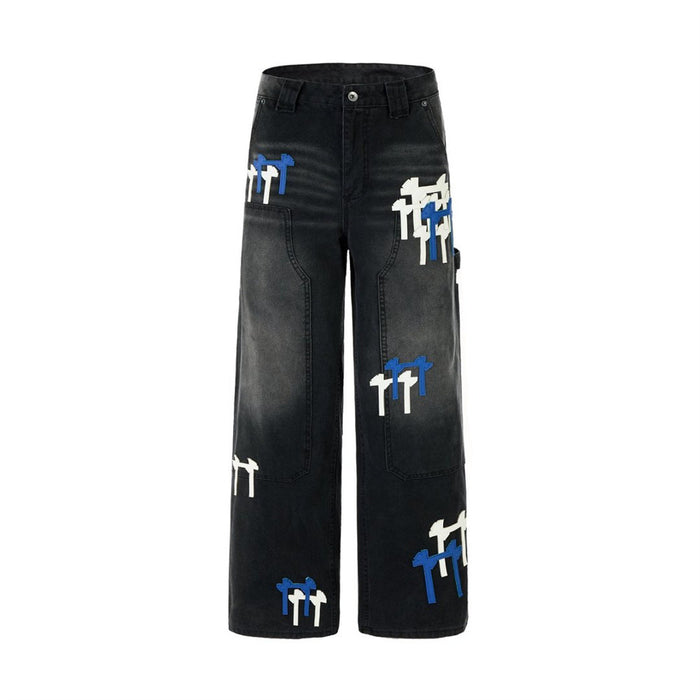 Full front product view of black washed wide-leg cargo jeans with white and blue patch details