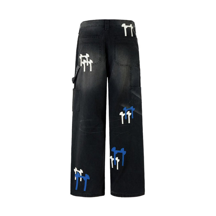 Full back view of black washed cargo jeans with rear pockets, cargo pockets, and white and blue patches