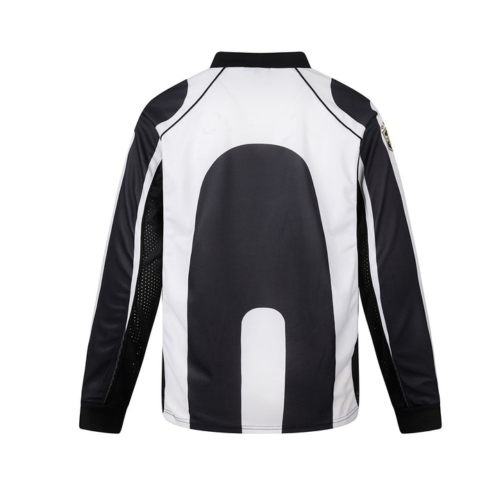 Back view of the black and white soccer jersey featuring a large rounded black panel on the white body
