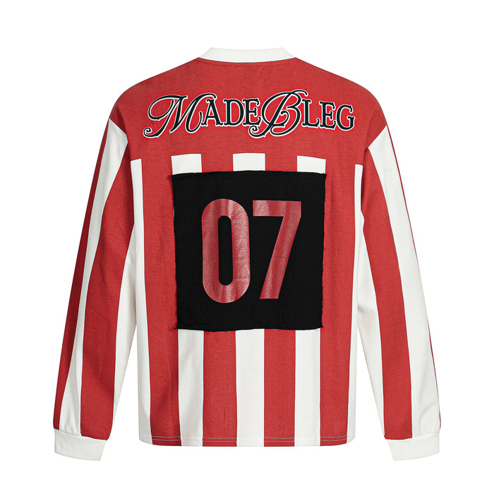 Back view of red striped long sleeve tee with MADEBLEG text and black 07 patch graphic