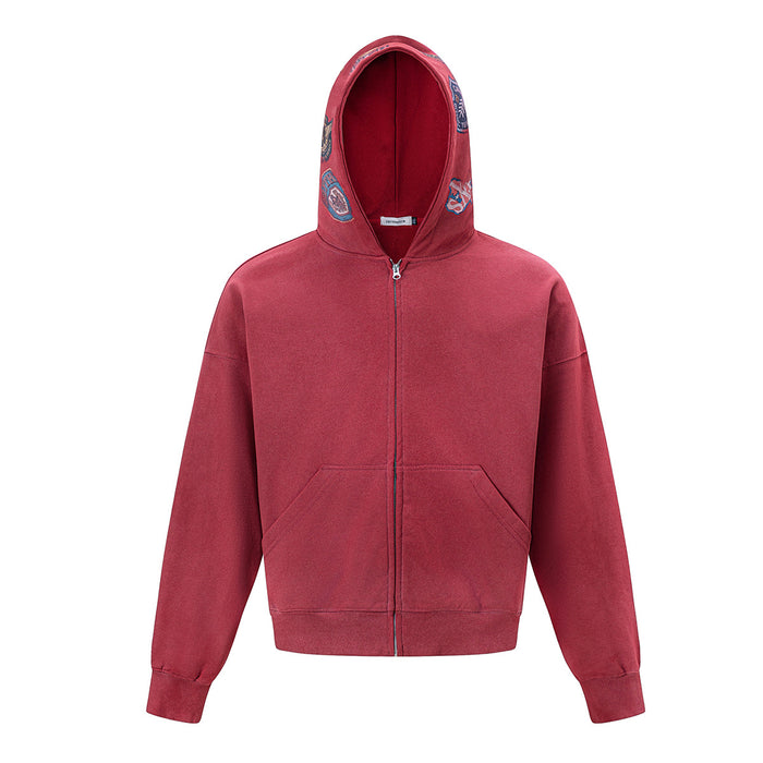 Front view of the red acid-wash zip-up hoodie with hood, full zipper, kangaroo pockets, and ribbed cuffs