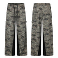 Men's wide-leg camouflage cargo pants with black contrast panel inserts and lace-up front detail, front and back view