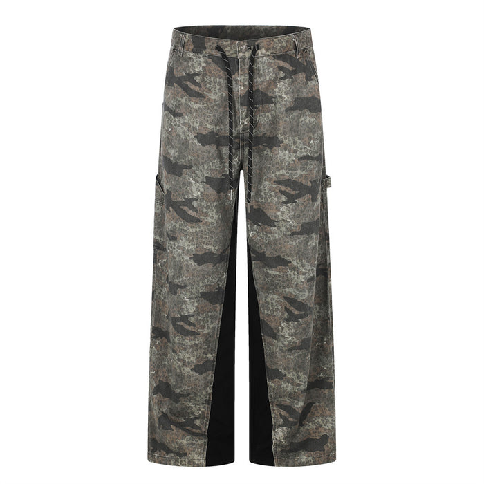 Front view of wide-leg camouflage cargo pants with dark contrast inner leg panels