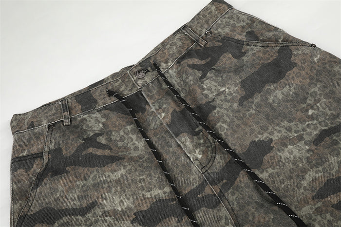 Flat lay close-up of the camouflage pants waistband, belt loops, button and zip fly