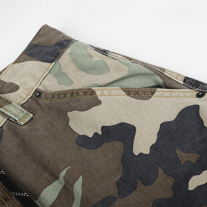 Close-up of the front waistband and top seam on camouflage patchwork pants
