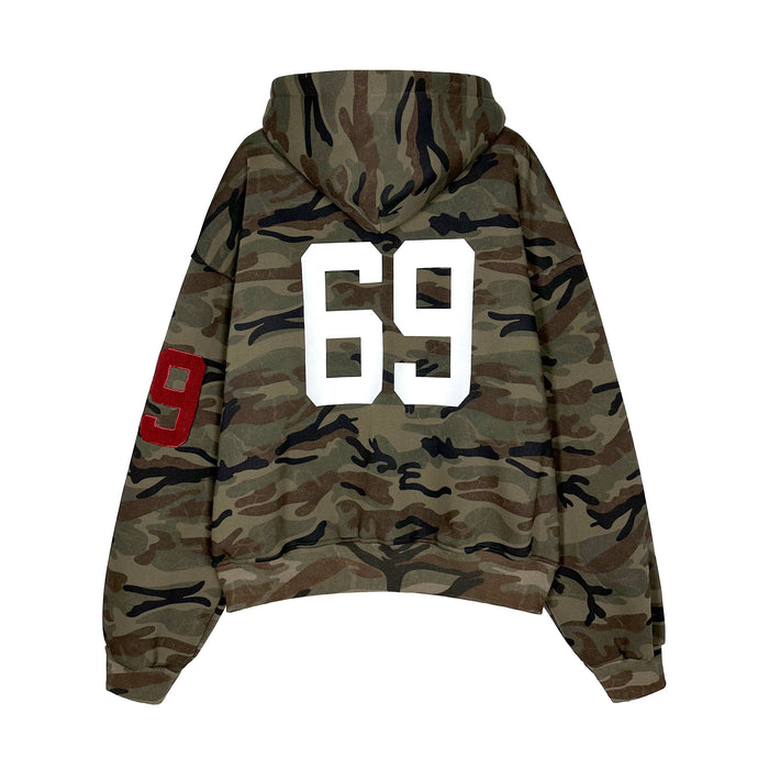 Back view of camo zip hoodie with large white 69 print and red sleeve patch