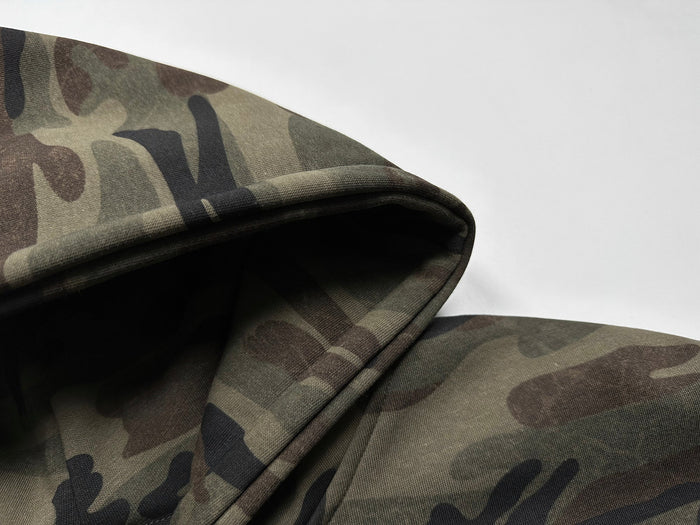 Close-up of camo hoodie sleeve cuff and hem stitching
