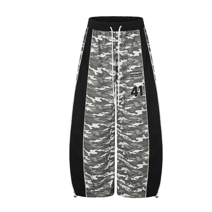 Grey camouflage wide-leg sweatpants with black side panels and number 41 patch, front and back view