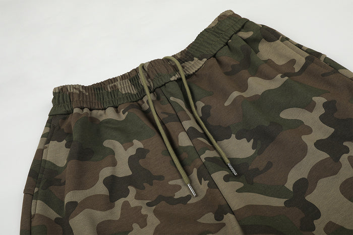 Close-up of the camouflage sweatpants waistband with elastic ribbing and matching drawstrings