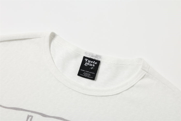 Crew neck collar close-up with brand label on white long-sleeve T-shirt