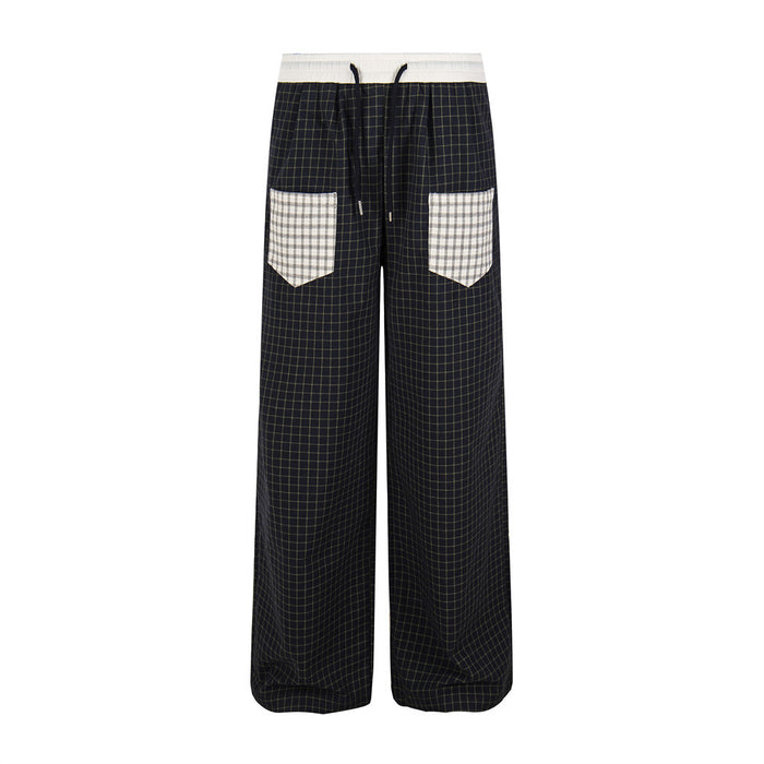 Black plaid wide-leg pants with white waistband and contrast plaid front pockets, front view