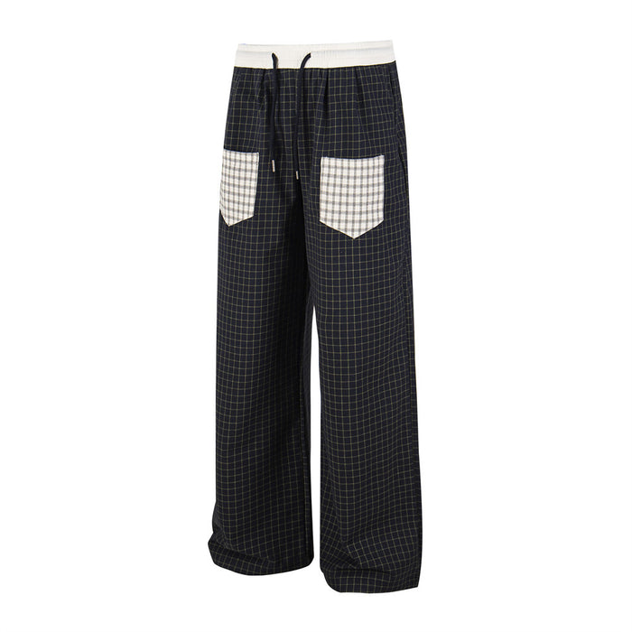 Black plaid wide-leg pants with white waistband and contrast plaid pockets, angled front view