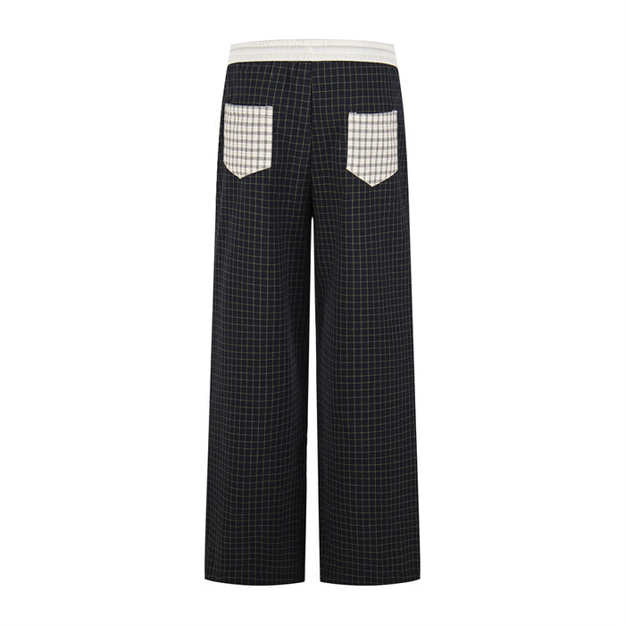 Black plaid wide-leg pants with contrast patch pockets and white waistband, back view