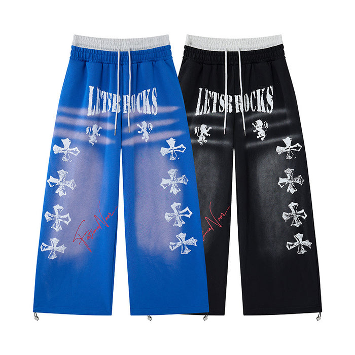 Wide-leg sweatpants with cross graffiti print and faux double waistband in black and blue colorways