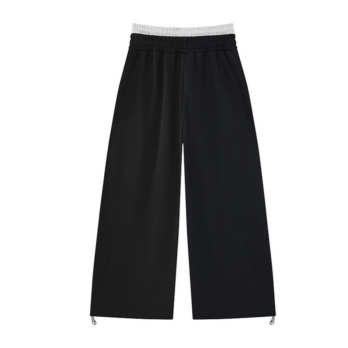 Back view of black wide-leg sweatpants with gray faux waistband and adjustable drawcord hems