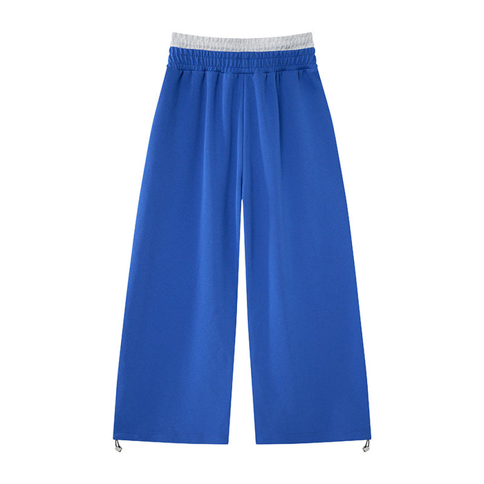 Back view of blue wide-leg sweatpants with gray faux waistband and adjustable drawcord hems