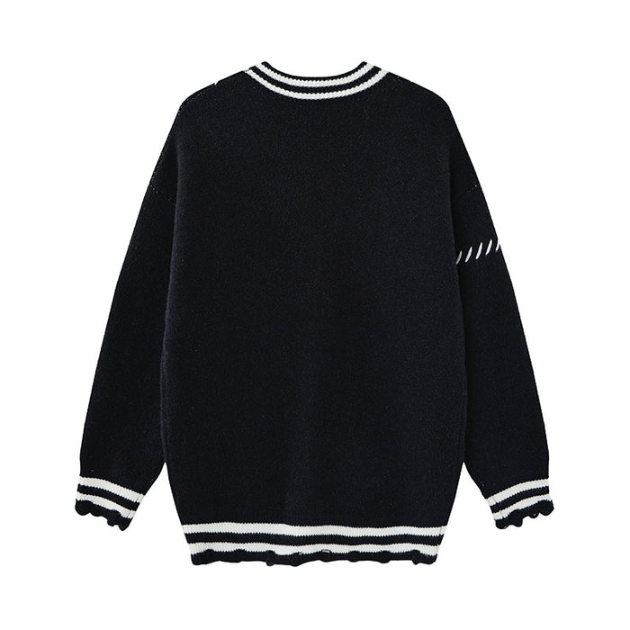 Black knit cardigan shown from the back with a plain body, striped collar and cuffs, and distressed ribbed hem