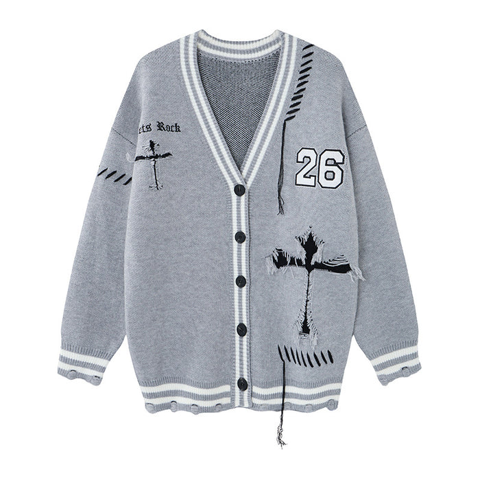 Gray knit cardigan front with striped V-neck trim, black buttons, number 26 patch, cross graphic and distressed details