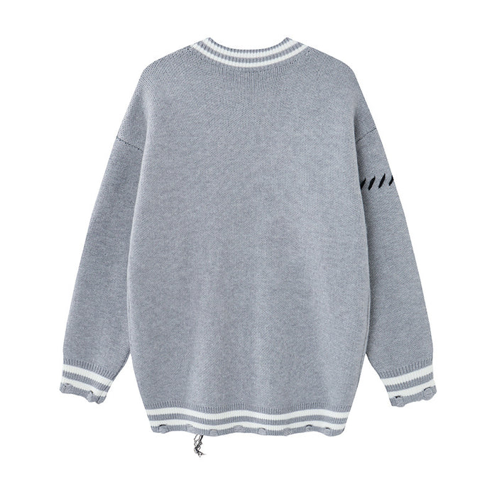 Gray knit cardigan shown from the back with a plain knit body, striped collar and cuffs, and distressed hem edge