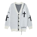 White distressed knit cardigan shown front-facing with cross motifs, V-neck, black buttons, gothic lettering, and loose threads